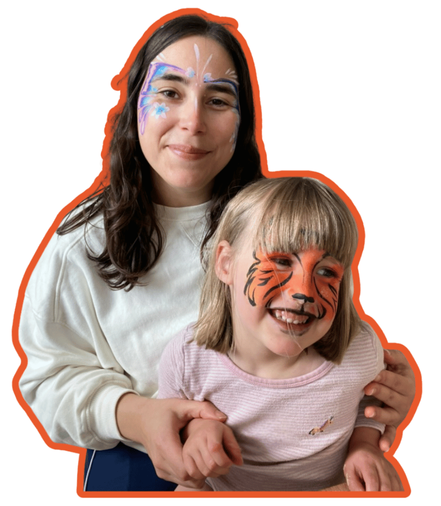Two people with face paint, one tiger and one butterfly, on a transparent background.